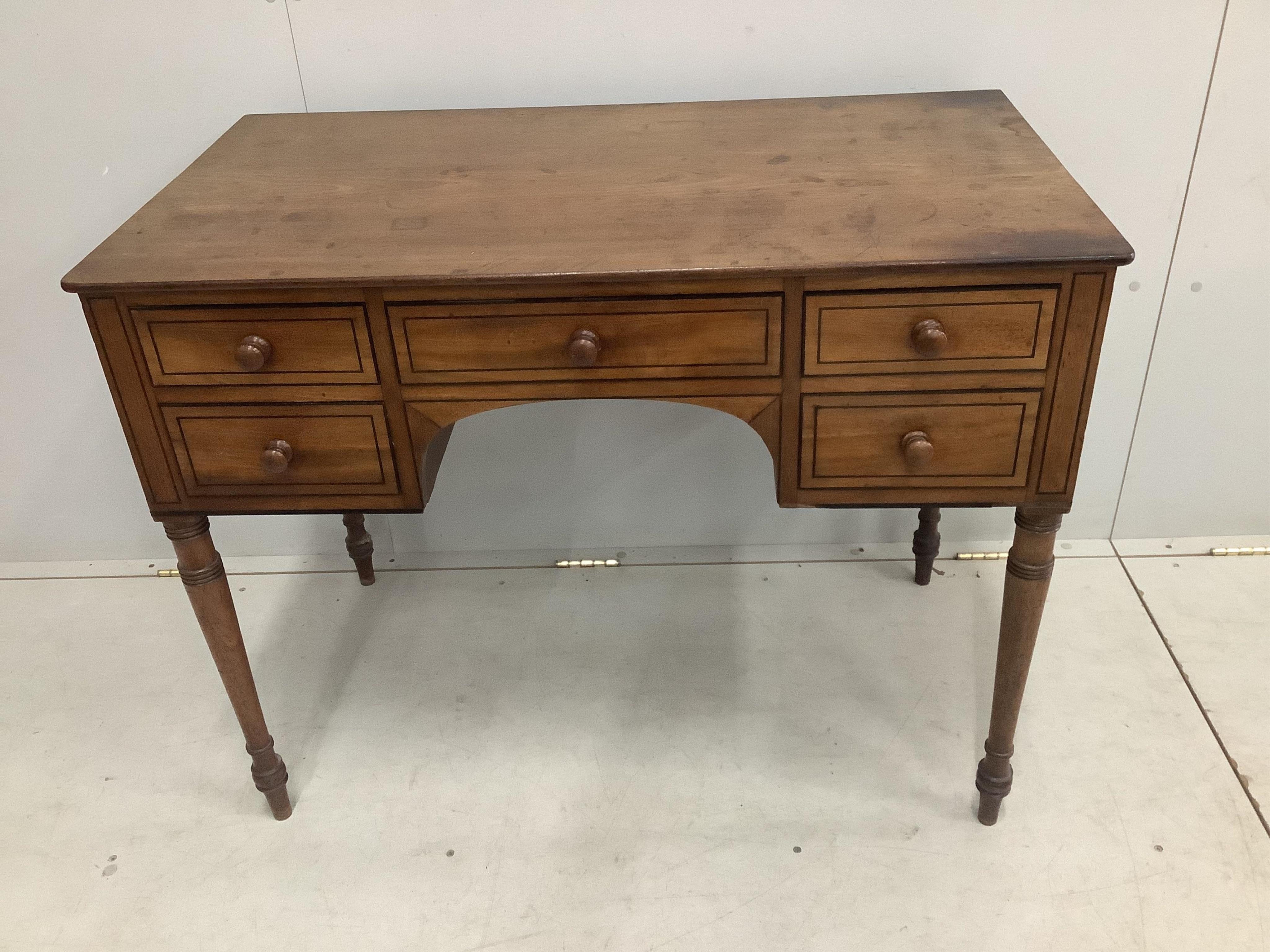A Regency ebony strung mahogany kneehole dressing table, width 99cm, depth 55cm, height 78cm. Condition - fair